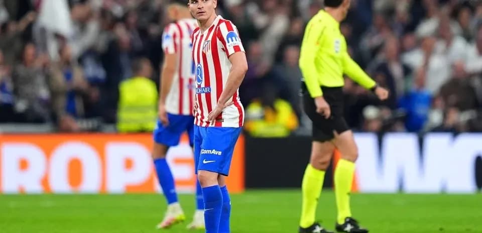 Atletico Madrid player standing on field during match