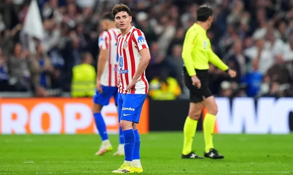 Atletico Madrid player standing on field during match