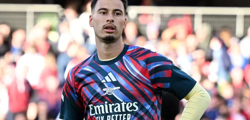Goalkeeper in colorful kit during warm-up session