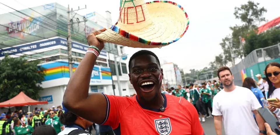 Fan in England jersey celebrating with sombrero hat