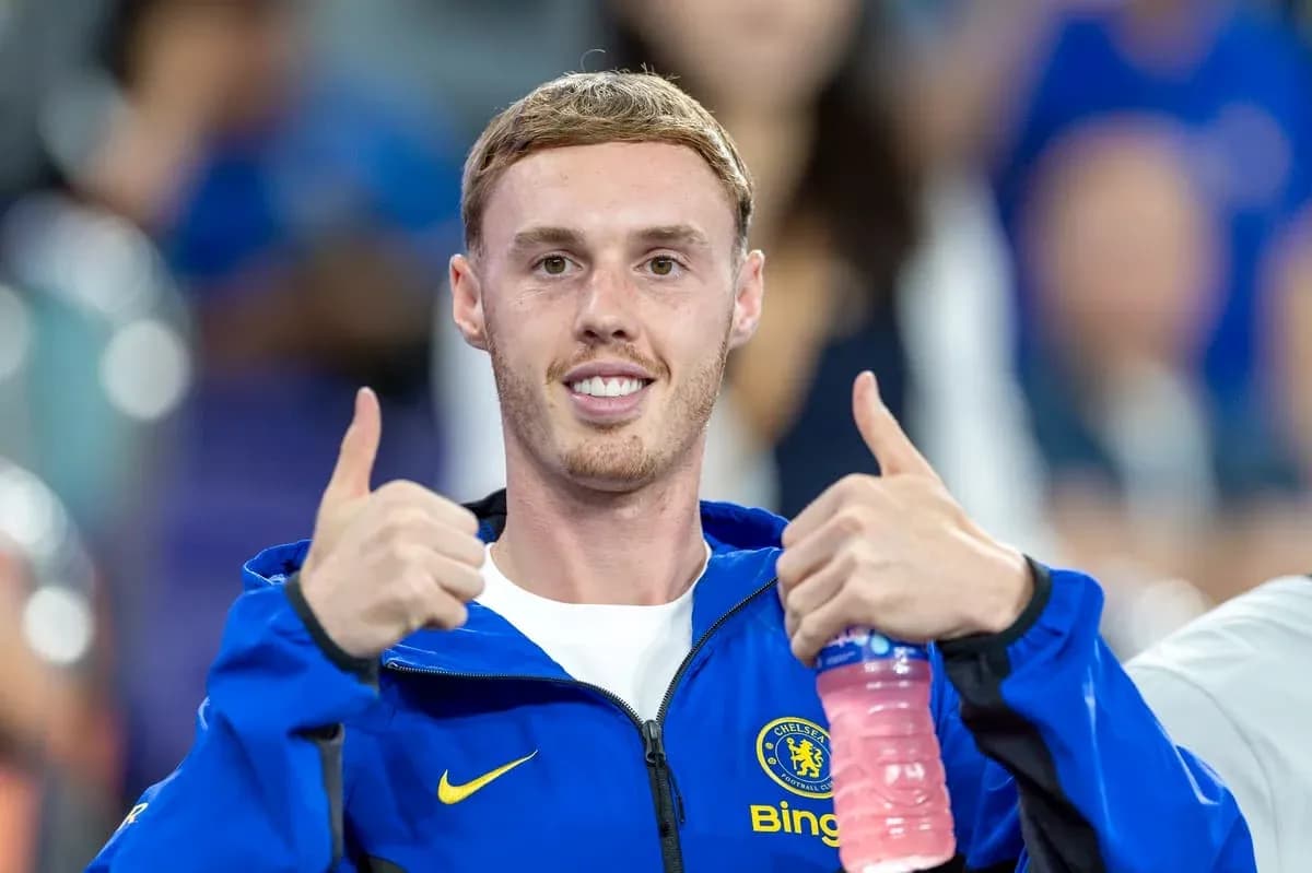 Player giving thumbs up in Chelsea jacket