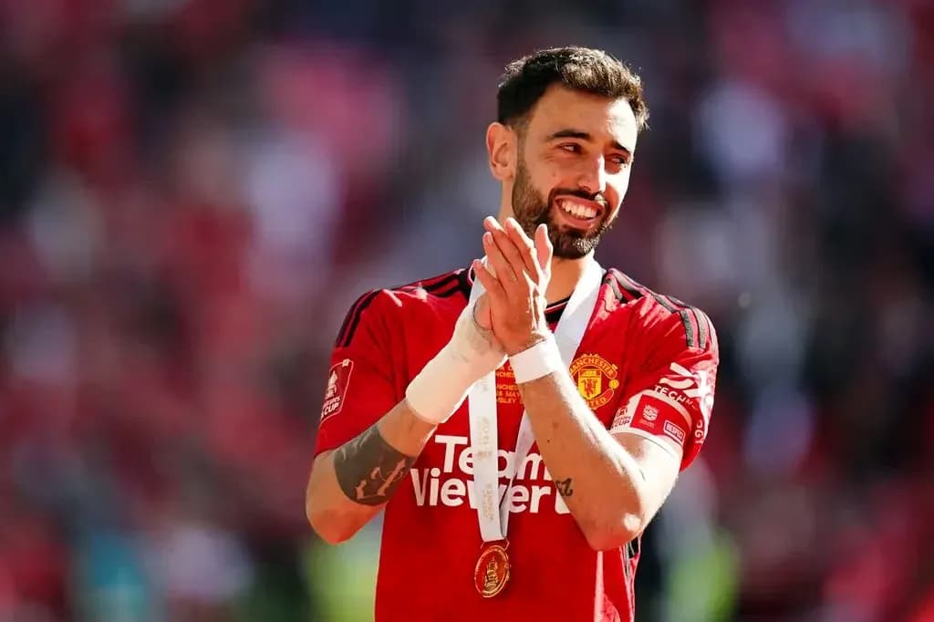 Player applauding with medal after match
