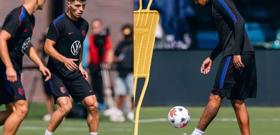 Two players training on the pitch with a soccer ball