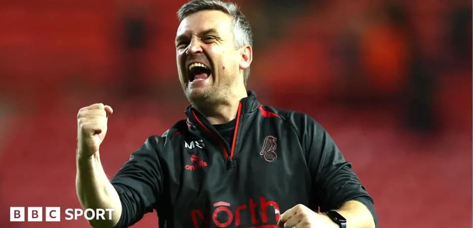Coach celebrating enthusiastically after match victory
