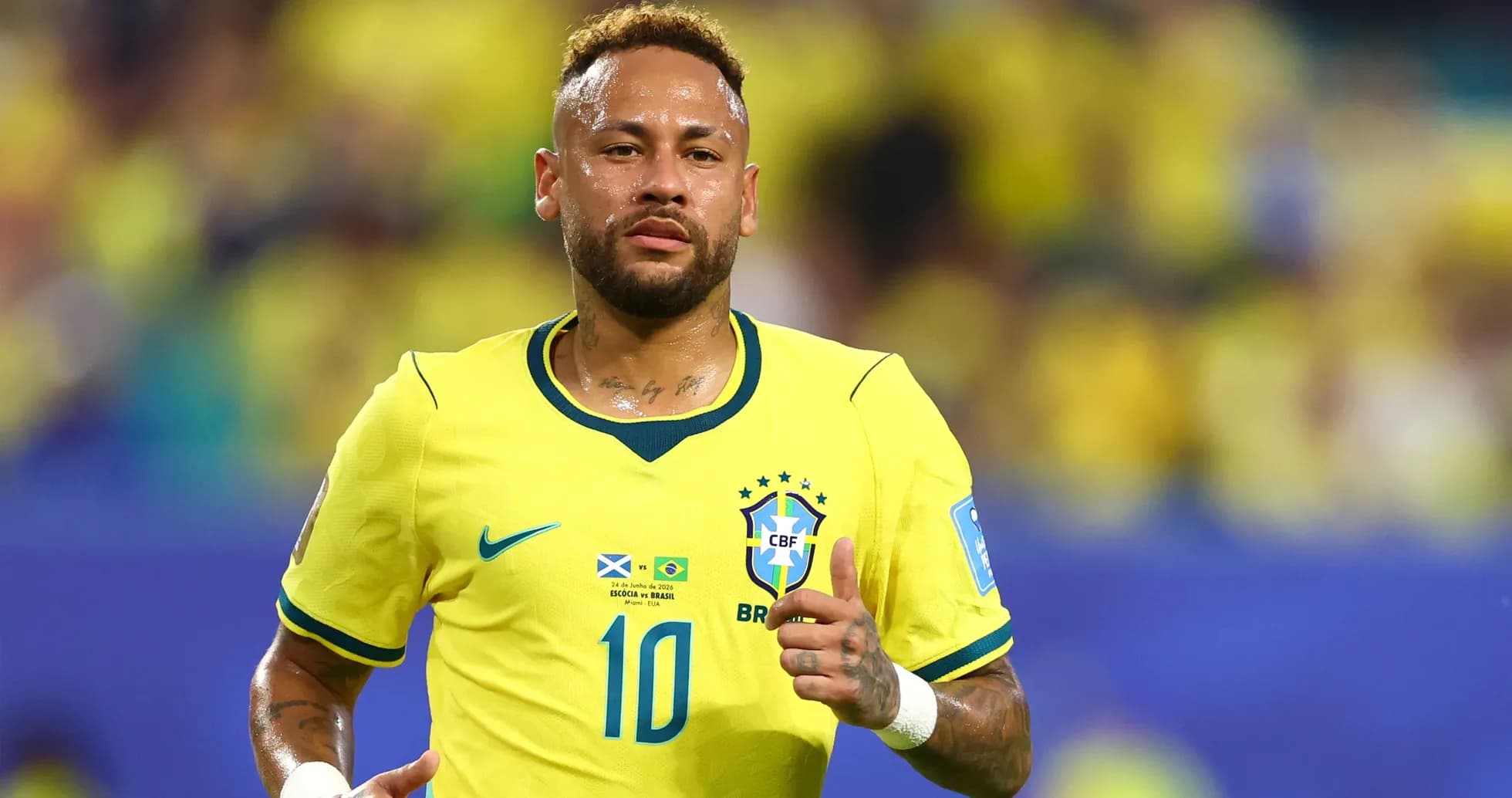 Neymar running on field in Brazil jersey