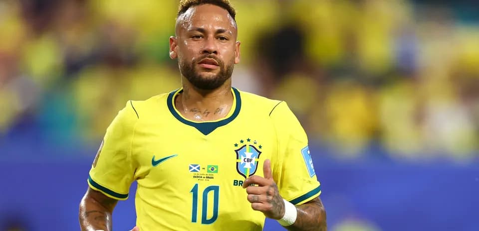 Neymar running on field in Brazil jersey