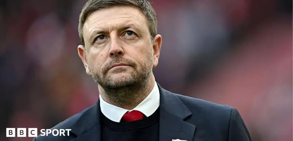 Manager observing match from the sidelines