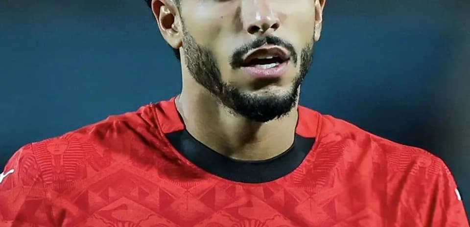 Player in red jersey during match for Egypt