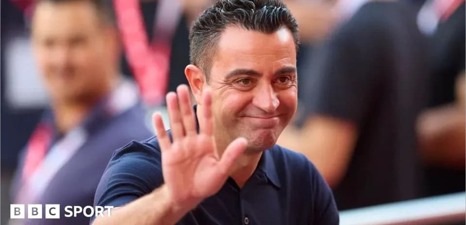Coach waving while smiling at the event