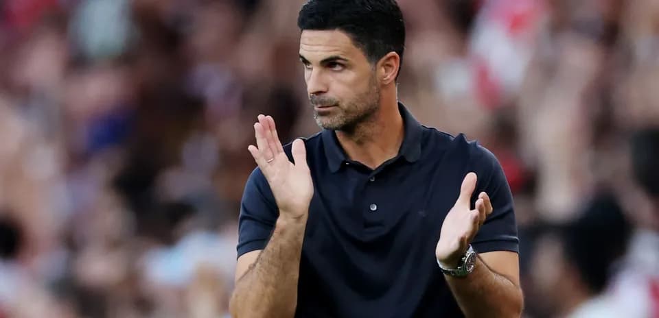 Manager applauding during a football match