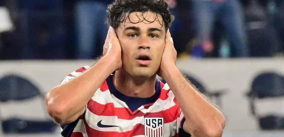 Player covering ears during a soccer match