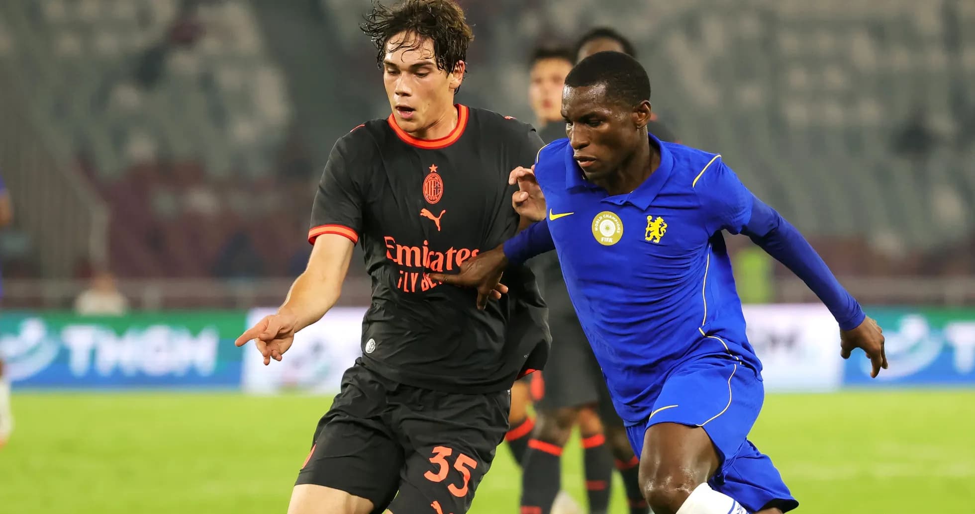 Two players competing for the ball in match