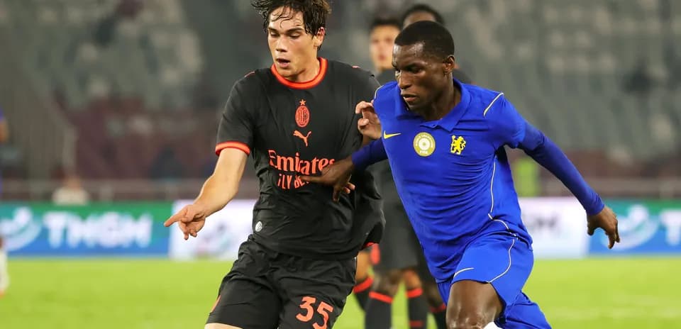 Two players competing for the ball in match