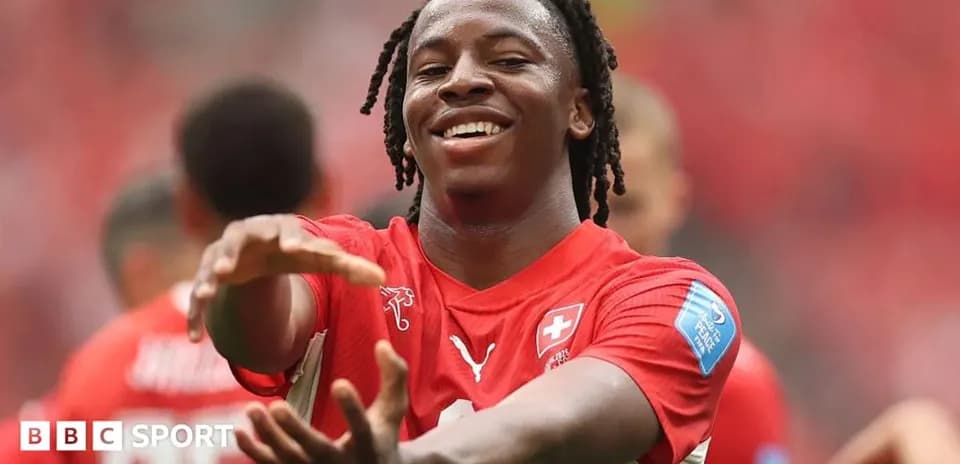 Player celebrating during match in red jersey