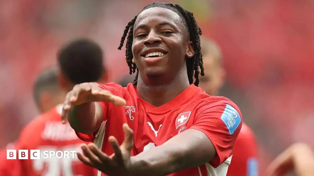Player celebrating during match in red jersey