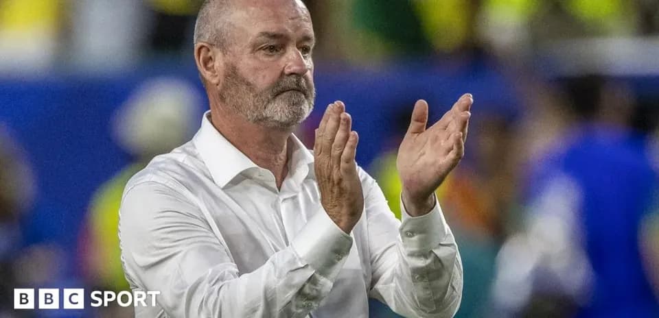 Coach applauding fans during a match