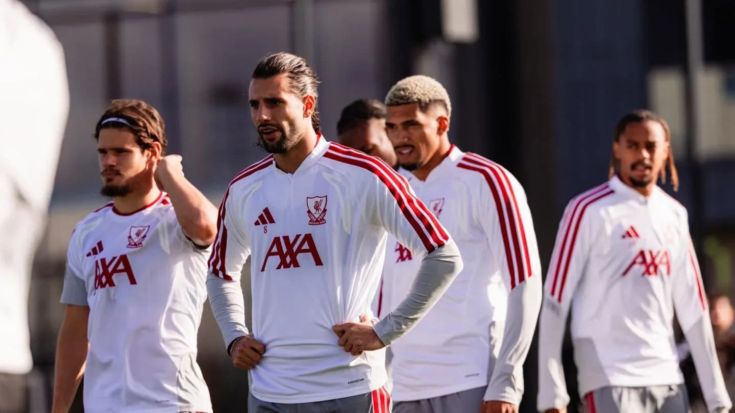 Liverpool players during training session on pitch