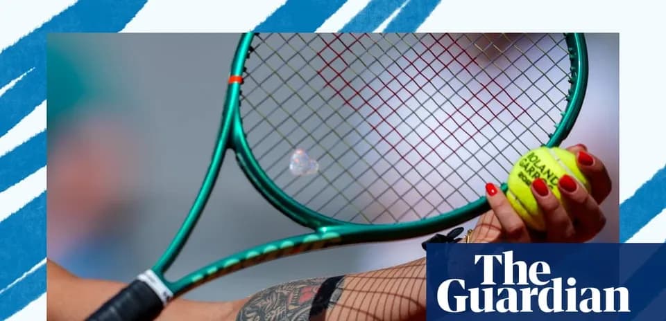 Tennis player holding racket and ball ready to serve