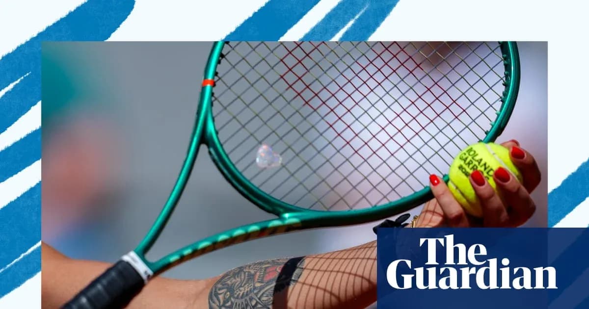 Tennis player holding racket and ball ready to serve