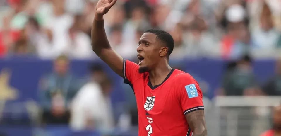 Player in red jersey signaling during match