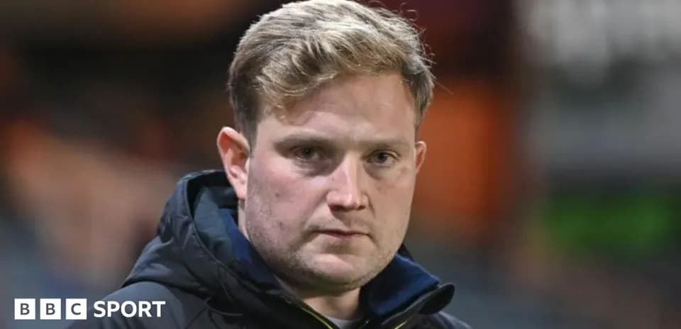 Coach looking serious during match preparations