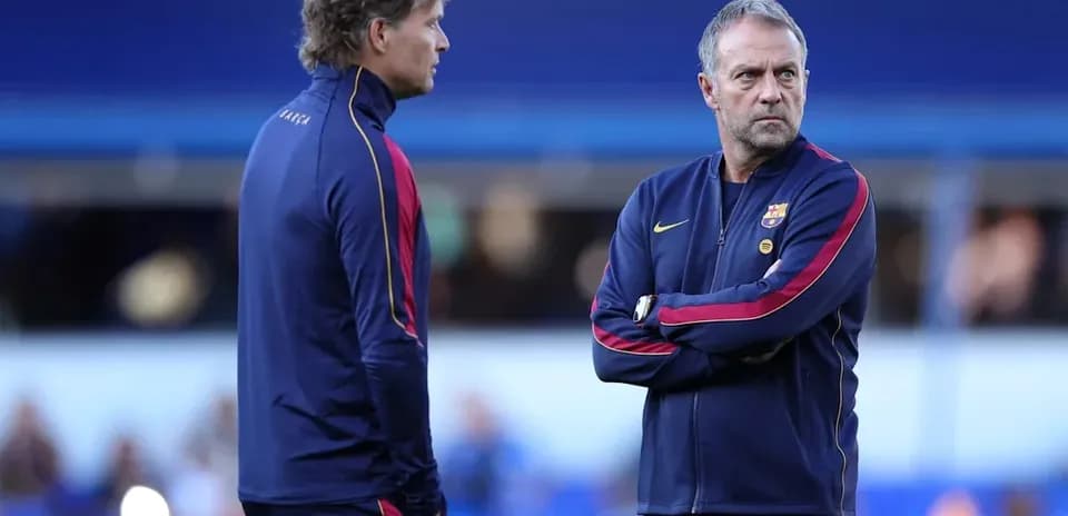 Two coaches discussing strategy during training session