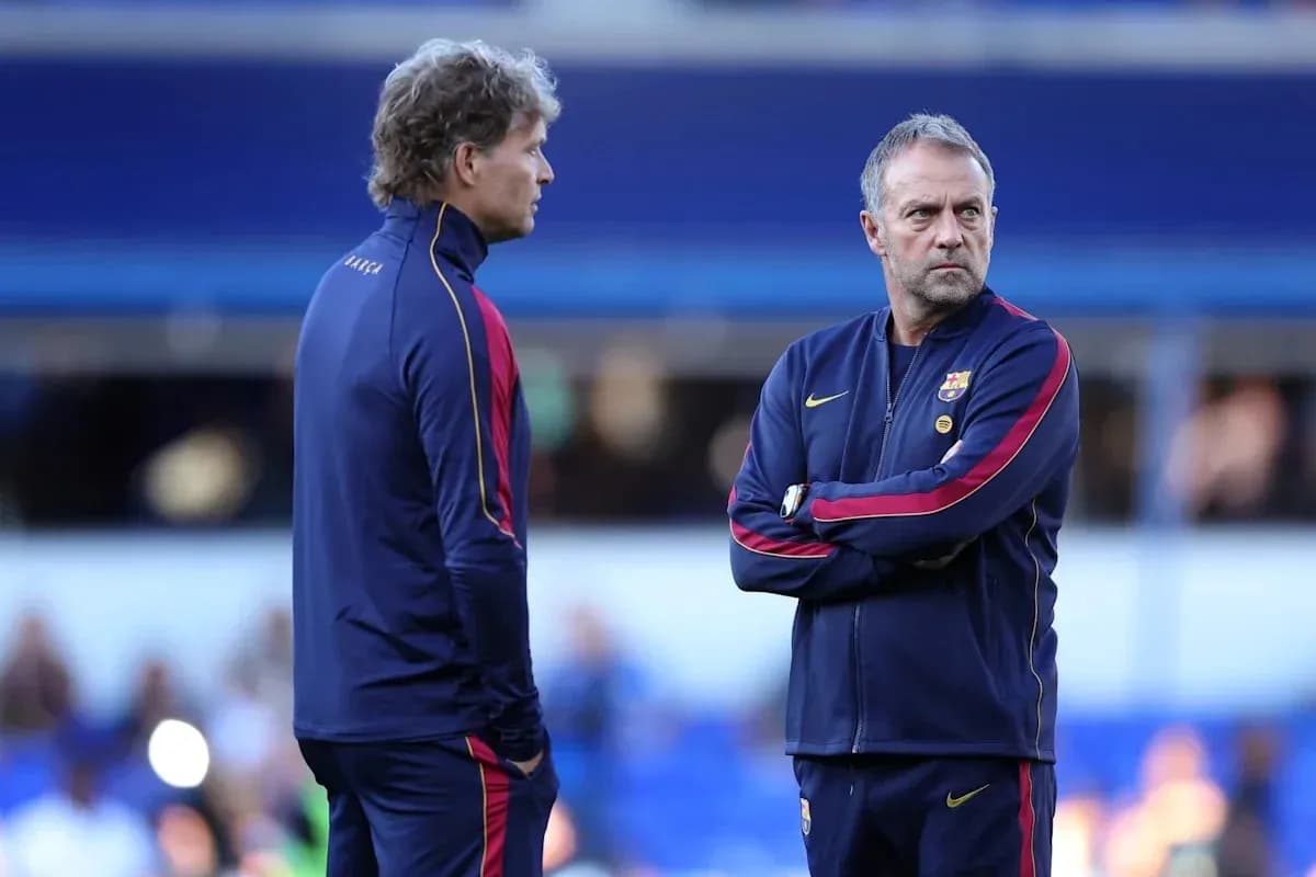 Two coaches discussing strategy during training session
