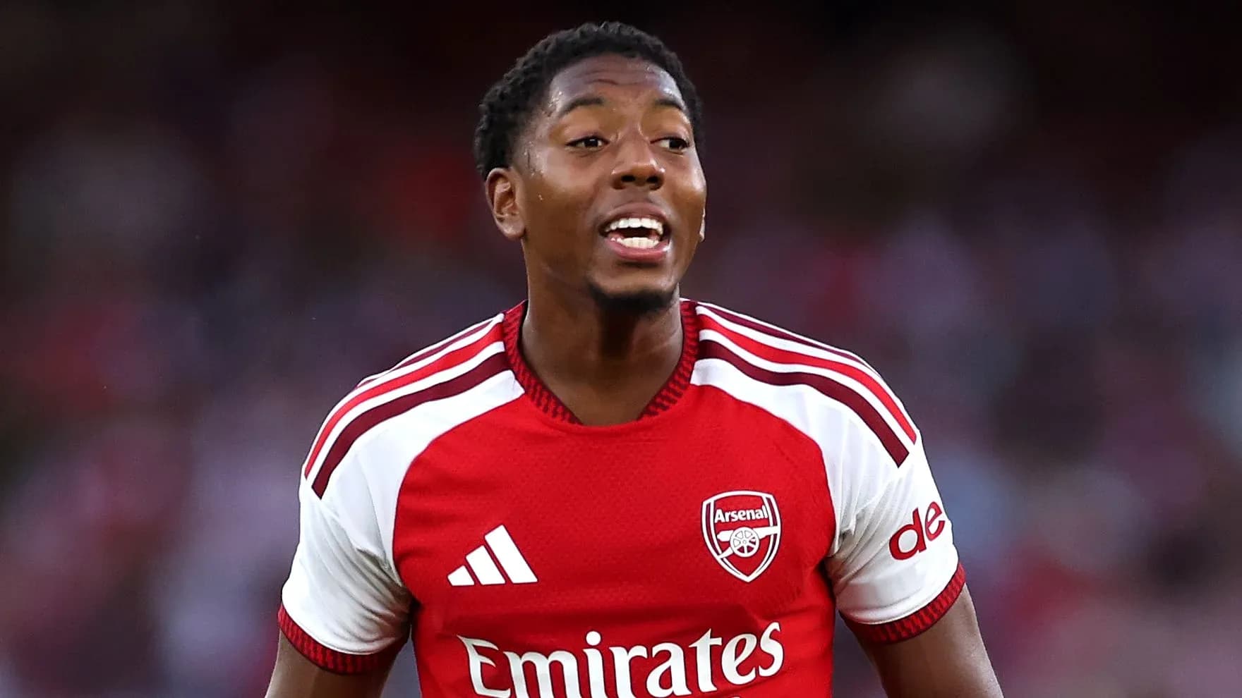 Player celebrating in Arsenal's red jersey