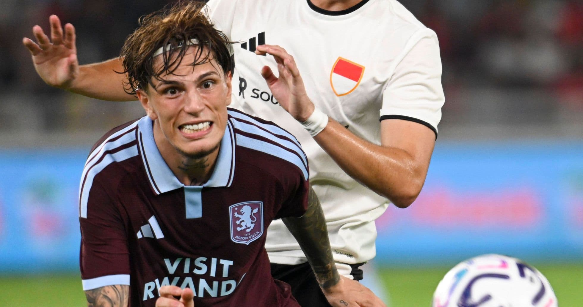 Player being challenged during a football match