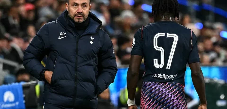 Manager discussing tactics with player during match