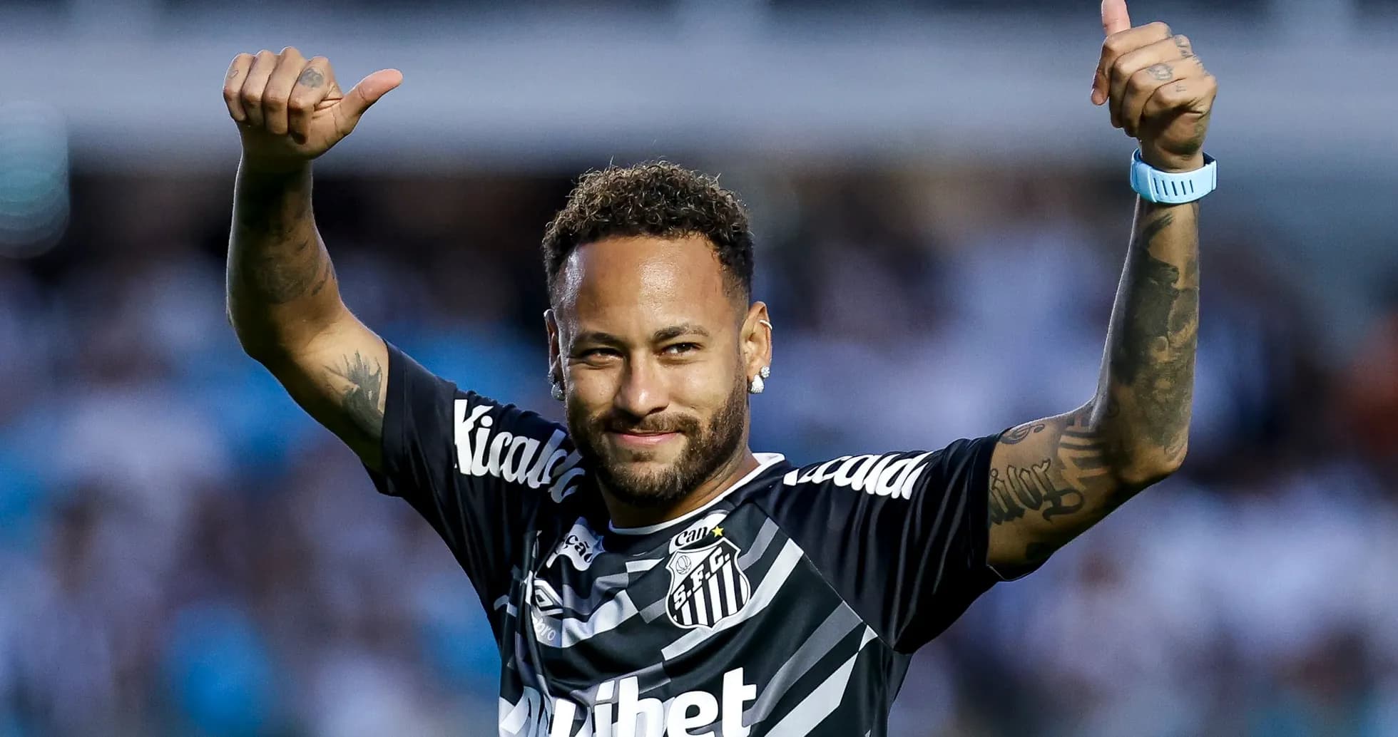 Neymar celebrating with thumbs up in Santos jersey