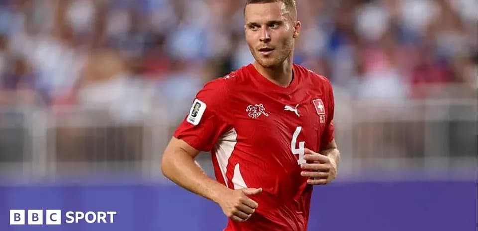 Swiss player in red jersey running on field