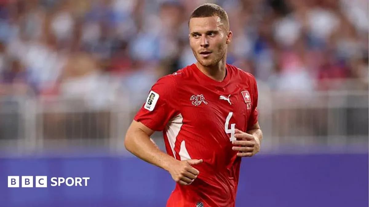 Swiss player in red jersey running on field