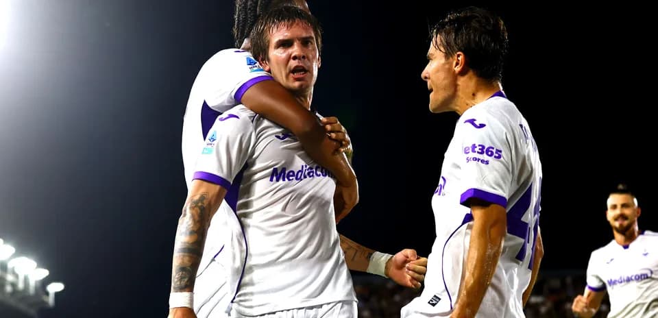 Players celebrating a goal during a match