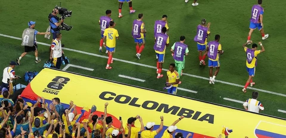 Colombia players celebrating with fans in stadium