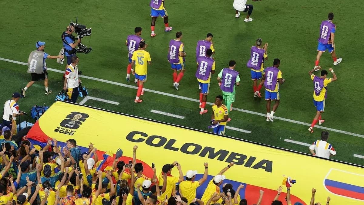 Colombia players celebrating with fans in stadium