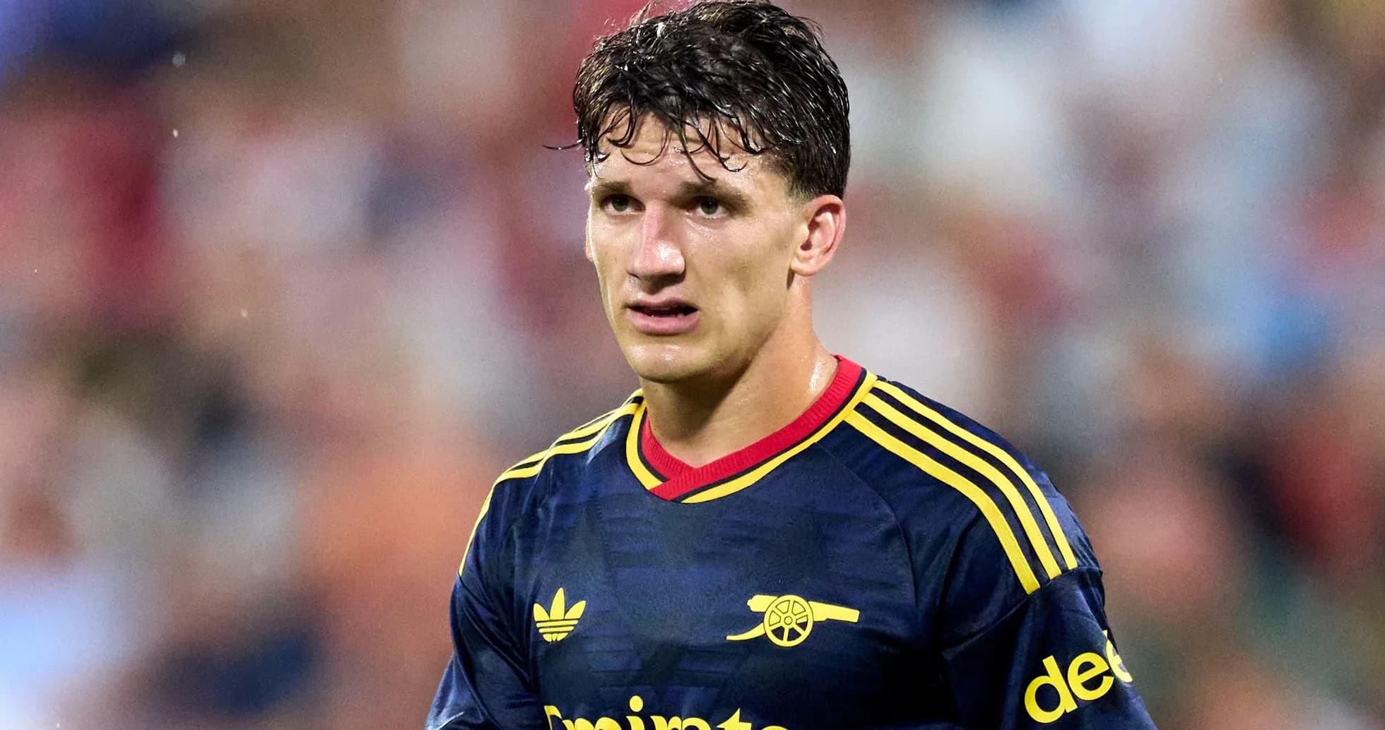 Player wearing Arsenal jersey during match