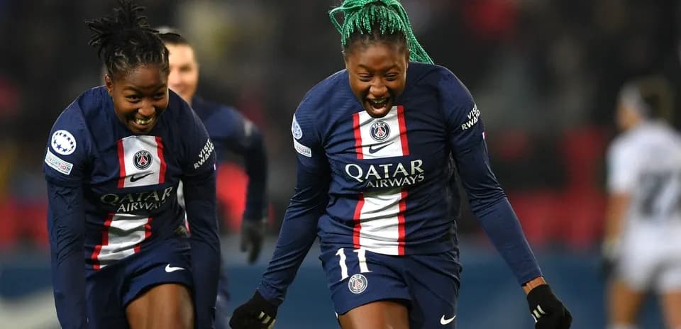 Two PSG players celebrating a goal