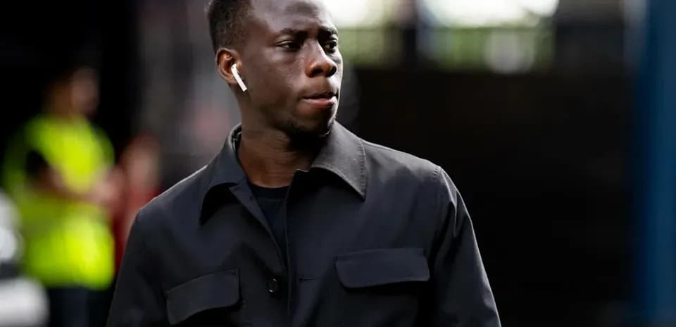 Player walking with AirPods in his ears