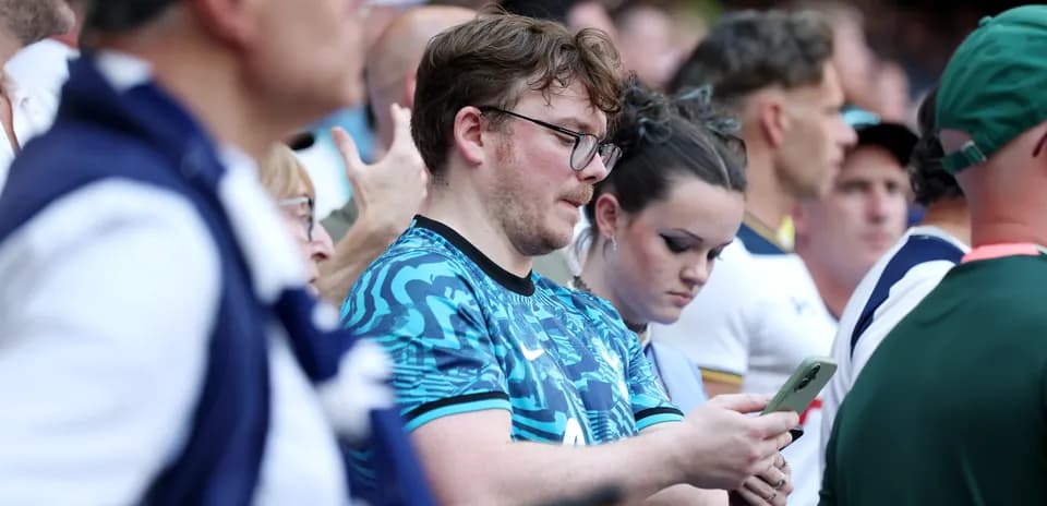 Fans focused on their phones during event