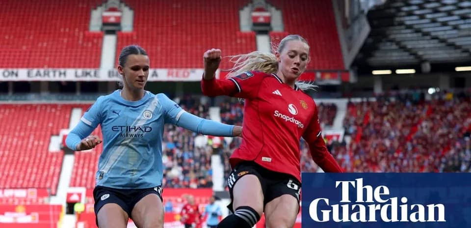 Manchester City player and Manchester United player competing