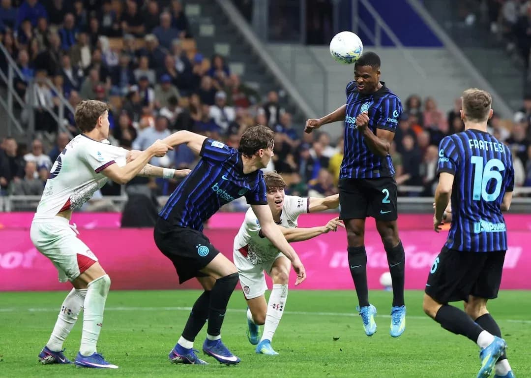 Inter player heading the ball during match