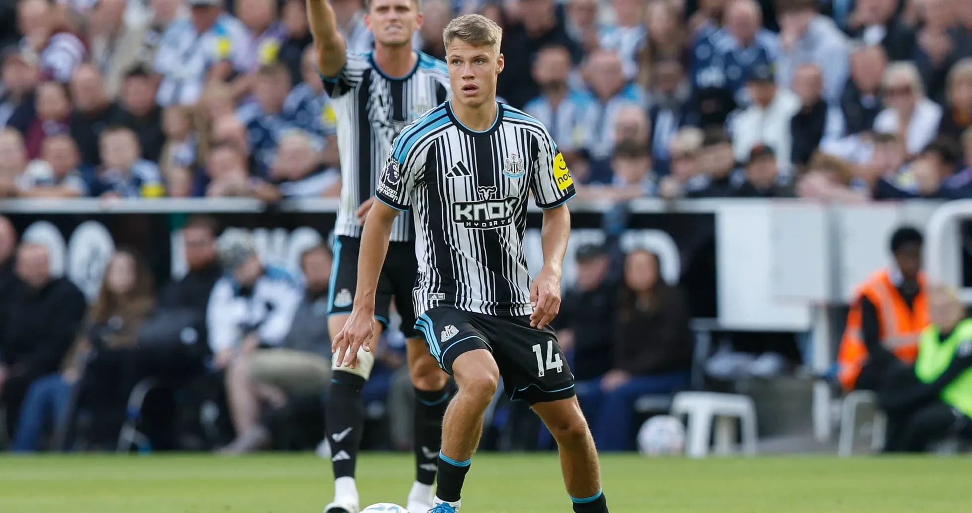 Newcastle player preparing to pass the ball