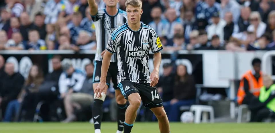 Newcastle player preparing to pass the ball