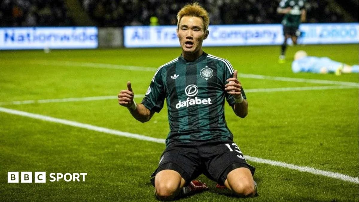 Player celebrating on the pitch after scoring