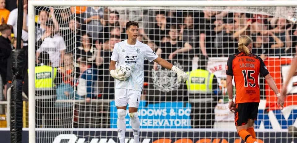 Goalkeeper in action during a tense moment