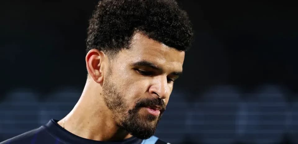 Player looking down during post-match reflection