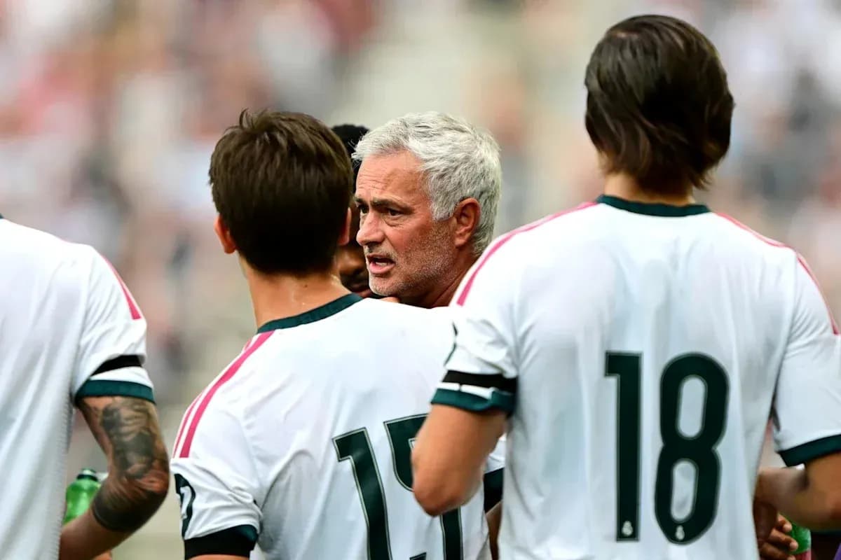 Manager discussing strategy with players during match