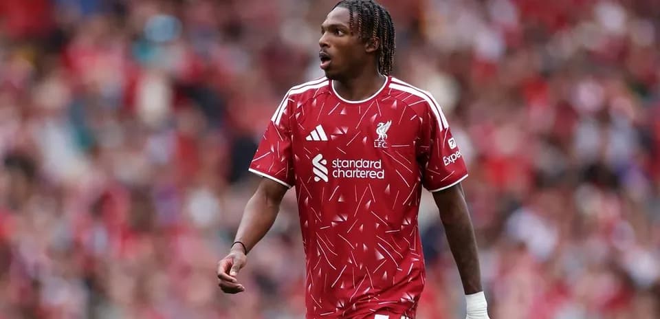Player wearing Liverpool kit on the pitch