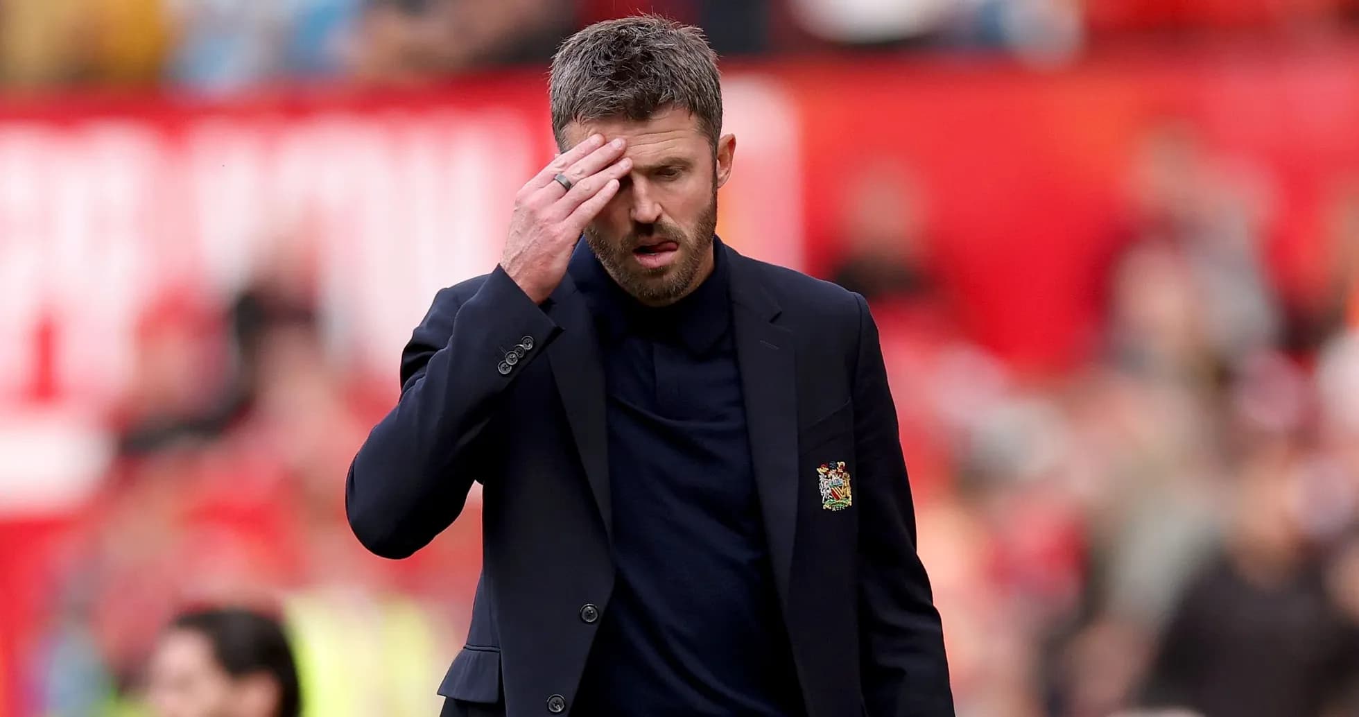 Manager walking on the pitch during match